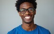 © Benjamin - Close up photo amazing he him his dark skin macho smart eyes white perfect teeth reliable person diligent student graduated university college wear specs casual blue t-shirt isolated grey background