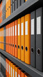 © Smart AI - Orange and gray file binders on shelf