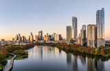 Aerial panoramic skyline of Austin Texas from the east at dusk or sunset in December 2025 with fall colors and clear sky