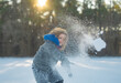 © Volodymyr - Amazed kid enjoying winter play with snowball. Happy child throwing snow outdoors. Winter outdoor playtime kid. Excited child snowball battle. Kid playing snow games. Amazed child throwing snowball.