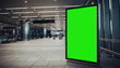 © ShareAboutThings - Vertical green screen digital billboard mockup in a modern, blurred airport or train station terminal for marketing and advertising display. Blank interactive panel for business promotions