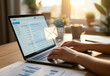 © Dionisia - Person deeply engrossed typing on a laptop, focused on sending an email at work, suitable for business or technology concepts.