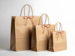 © tinyicon - Three brown paper bags of varying sizes, each adorned with a pink ribbon tied in a bow, arranged neatly on a plain background, suggesting a festive takeout meal.