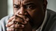 © Tatiana - Close up of an african american man looking anxious. Mature male with worried facial expression symbolizing stress, grief or emotional difficulty for mental health concept.