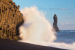 © Michal - Traveler on a huge rock in the sea. Hikers in front of the basalitic stacks of Iceland's Black Beach. Humanity and nature. Travelling, exploring, northern lands, volcanoes, feeling small. Reynisfjara,