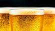 © xi - Close up of fresh cold beer glasses with foam and bubbles on dark background, refreshment drink at pub or party