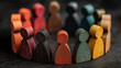 © Abu - Colorful wooden figurines of people standing in circle representing diversity equality