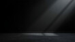 © MDZAHANGIR - A dark abstract studio background featuring a matte black textured wall and a lighter charcoal floor, with subtle diagonal light rays creating soft gradients and depth.