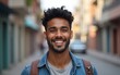 © Sophia - Young man indian smiling and looking at camera. Portrait of a happy handsome young man in a urban street. High quality