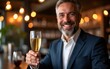 © Sophia - business mature man holding a glass of champagne wine and smiling while standing at the bar with beautiful bokeh light. High quality
