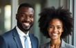 © Emery - Portrait of a smiling black business man and black business woman. High quality