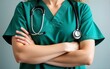 © Daniel - Close-up of a medical doctor wearing green scrubs with a stethoscope hanging around their neck, arms crossed in front. High quality