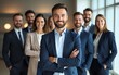 © Anthony - Diverse group of business people team standing in an office, smiling and looking at the camera with arms crossed. A man posing as the leader is in the center posing for a portrait. High quality