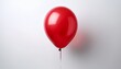 © Cory - a single red balloon floating against a plain white background creating a simple yet striking image alone air