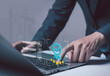© loechai - businessman touching a glowing checkmark icon represents quality assurance, successful project completion, and efficient business process management in a modern technology-driven environment.