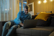 © Nenad - Mature man using laptop and smiling