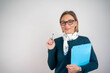 © Nenad - Photo of gorgeous blond secretary woman writing notes on clipboard in office