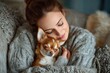 © Iftikhar alam - Happy woman enjoys a cozy moment with her Chihuahua in a warm living room filled with soft blankets and comfort