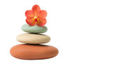 Zen stones with orange orchid isolated PNG, stacked pebbles for spa and wellness concept on transparent background
