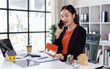 © David - Home loan contract. house model on workplace desk with real estate agent professional making business call talking on mobile phone with customer for signing rental lease contract in office concept