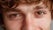 © Thares2020 - Detailed close up of a young person s warm expressive brown eyes showcasing a look of curiosity and gentle introspection