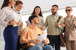 © Pixel-Shot - Job applicants with blind woman and man in wheelchair at office