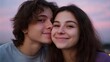© Thares2020 - A young couple shares a tender embrace smiling happily against a vibrant twilight sky