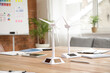 © Pixel-Shot - Wind turbine models on table in office, closeup