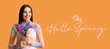 © Pixel-Shot - Beautiful young woman with hyacinth flowers and text HELLO, SPRING on orange background