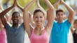 © liliyabatyrova - In a lively outdoor park, diverse adults engage in yoga, stretching their arms toward the sky. They share smiles and create a warm atmosphere of unity, health, and joy among friends