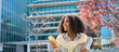 © insta_photos - Smiling happy African teen girl student holding cellphone looking away with smartphone technology in hand walking in college park outside using apps on mobile phone, authentic shot. Banner for ads