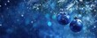 © li - christmas background with blue balls and bokeh lights on the right side, copy space concept, wide banner for web design or social media post, christmas card template, wide banner for website