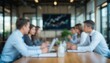© saranya - Blurred view of business professionals in a modern office meeting, conveying teamwork, strategy, and corporate collaboration with soft focus and natural light