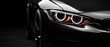 © Jdgkxbnc - close-up of a sleek black sports car front with glowing led halo headlights, amber turn signal, glossy hood and visible wheel, conveying power, speed and aggressive elegance