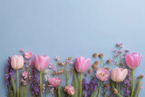 Pink tulips and wildflowers in a minimal flat lay capture the joy of spring Generative AI