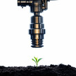 © Funni - Irrigation System Watering a Young Plant in the Soil