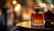 © Oleksiy - A bottle of perfume sits on a table, ready for use