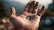 © Yurij - Human hand holding a recycle symbol in the palm representing environmental awareness and the importance of sustainability in protecting nature and conserving resourc
