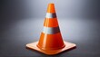 © Jason - bright orange traffic cone on a gray background with soft lighting