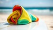 © guangyu - rashguard. A colorful rolled-up rashguard resting on a surfboard at the beach. event key visuals, club posters, designed for fitness apps and gym onboarding, drives event promotion.