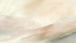 © mila103 - A view of a mountain landscape showing soft colors of brown and cream. Mist covers the lower areas. This scene captures the early morning light filling the sky.
