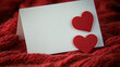 © jian - Folded blank card mockup on red knitted background with two red hearts, romantic winter holiday greeting card backdrop, Valentine's Day or anniversary invitation template, copy space design, elegant c