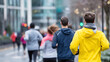 © Kateryna - Faceless young group of friends running and jogging together heavily defocused city background anonymous people during winter or autumn urban fitness activity social exercise