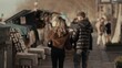© 4kclips - A romantic couple walks along the Seine River in Paris France browsing the book stalls and enjoying the city lifestyle They are wearing winter fashion and traveling together creating a scene of love a