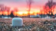 © tashechka - Sound device sits on grass during sunset in a park setting