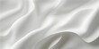 © FSompa - Elegant white silk and satin fabric background featuring soft luxury waves and smooth rippled textures for a shiny wedding drapery backdrop design