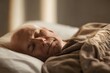 © Studicon - Calm elderly man resting peacefully under a warm blanket in his cozy bedroom