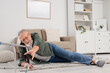 © Pixel-Shot - Senior man lying on floor after fall with walker at home
