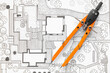 © Pixel-Shot - Pair of compasses on zoning plan, top view