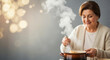© Vyatcheslav - Happy senior woman tasting delicious hot soup from a pot. Healthy homemade cooking and cozy lifestyle concept with copy space